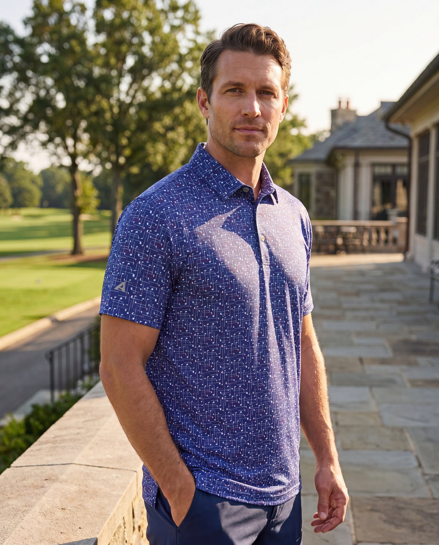 Generated lifestyle model wearing the blue printed Antigua golf polo outdoors
